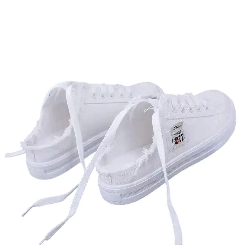 Zapatillas mule de denim deshilachado para mujer