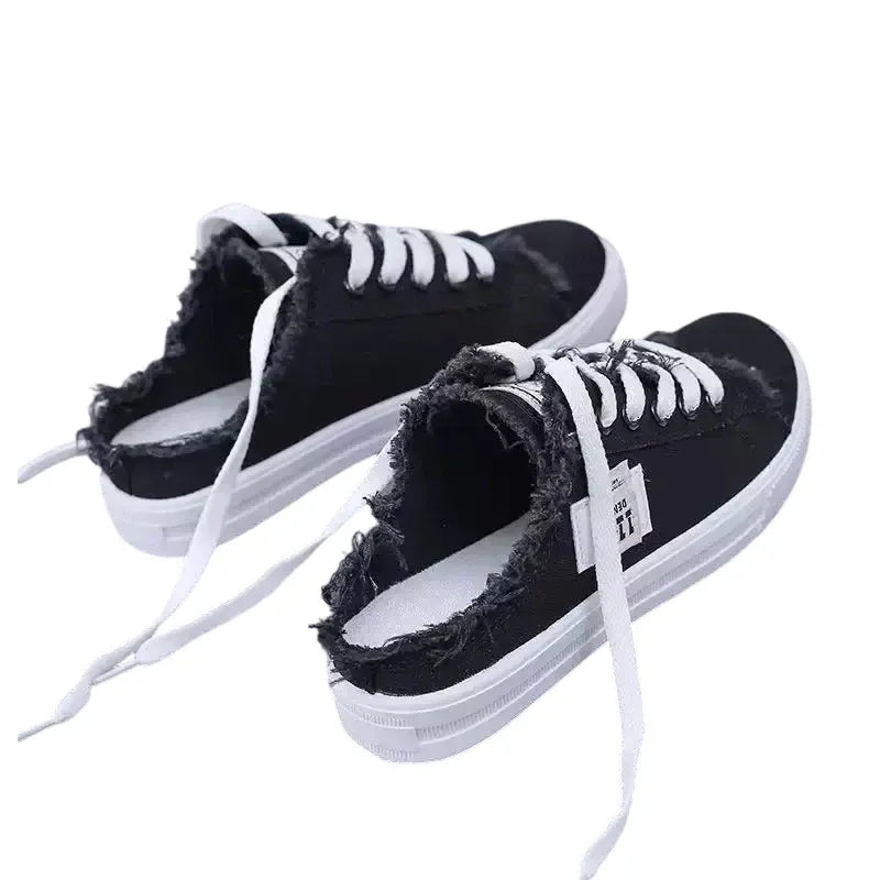 Zapatillas mule de denim deshilachado para mujer