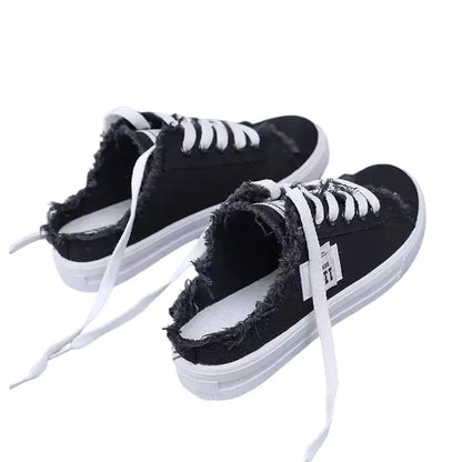 Zapatillas mule de denim deshilachado para mujer