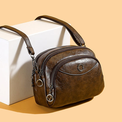 👜 Nová mäkká kožená crossbody kabelka, veľká kapacita, viacvrstvový dizajn, moderný retro štýl.