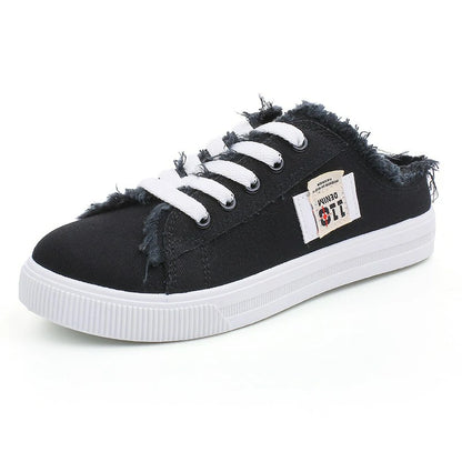 Zapatillas mule de denim deshilachado para mujer