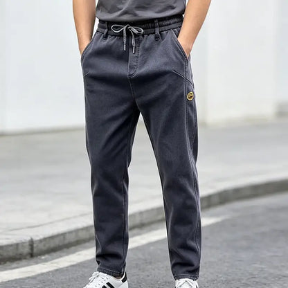 👖【M-6XL】Pánske džínsy so širokými nohavicami, elastické, pohodlné, odolné voči špine a vhodné do práce